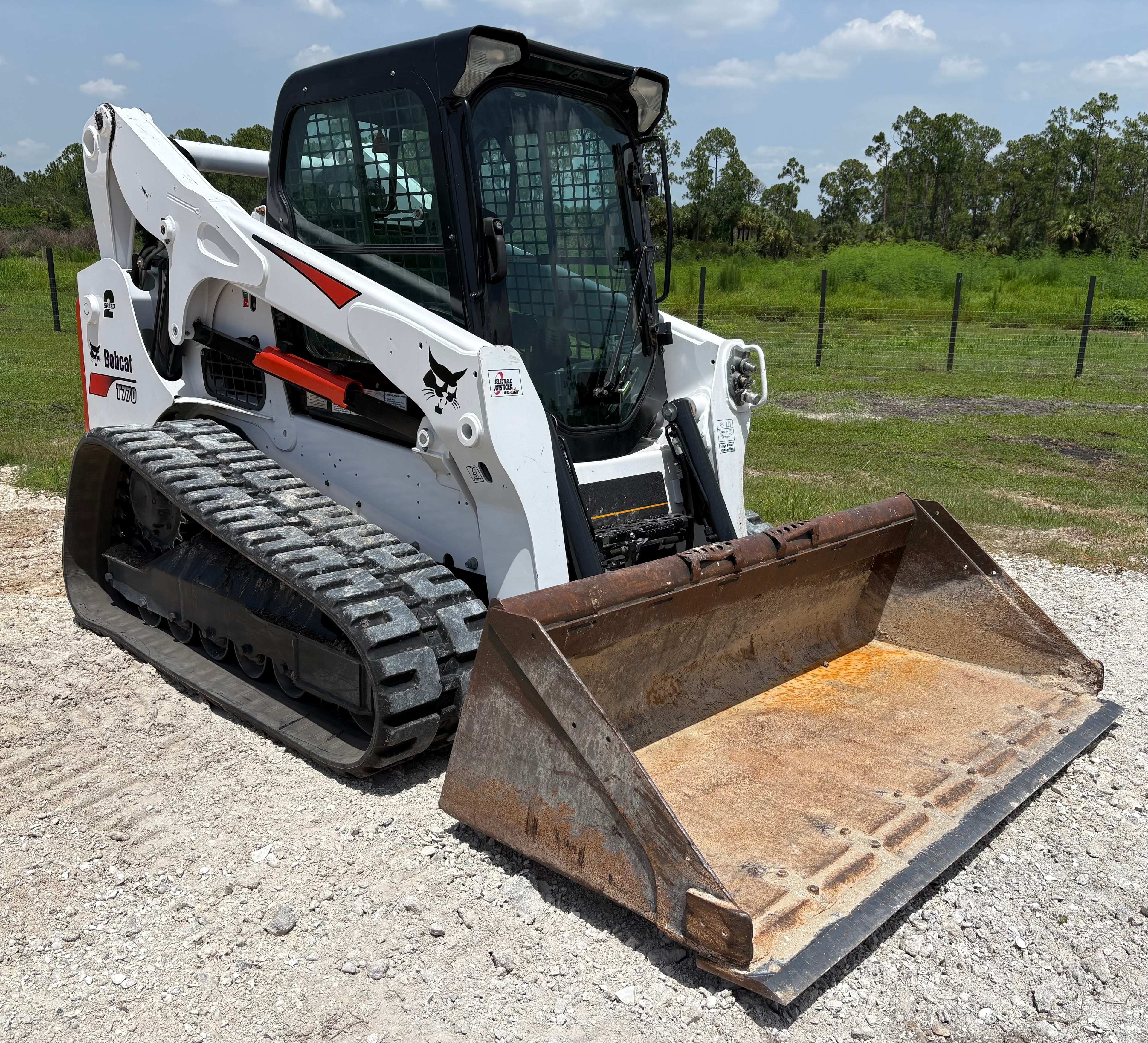 Skid steer with bucket attachment